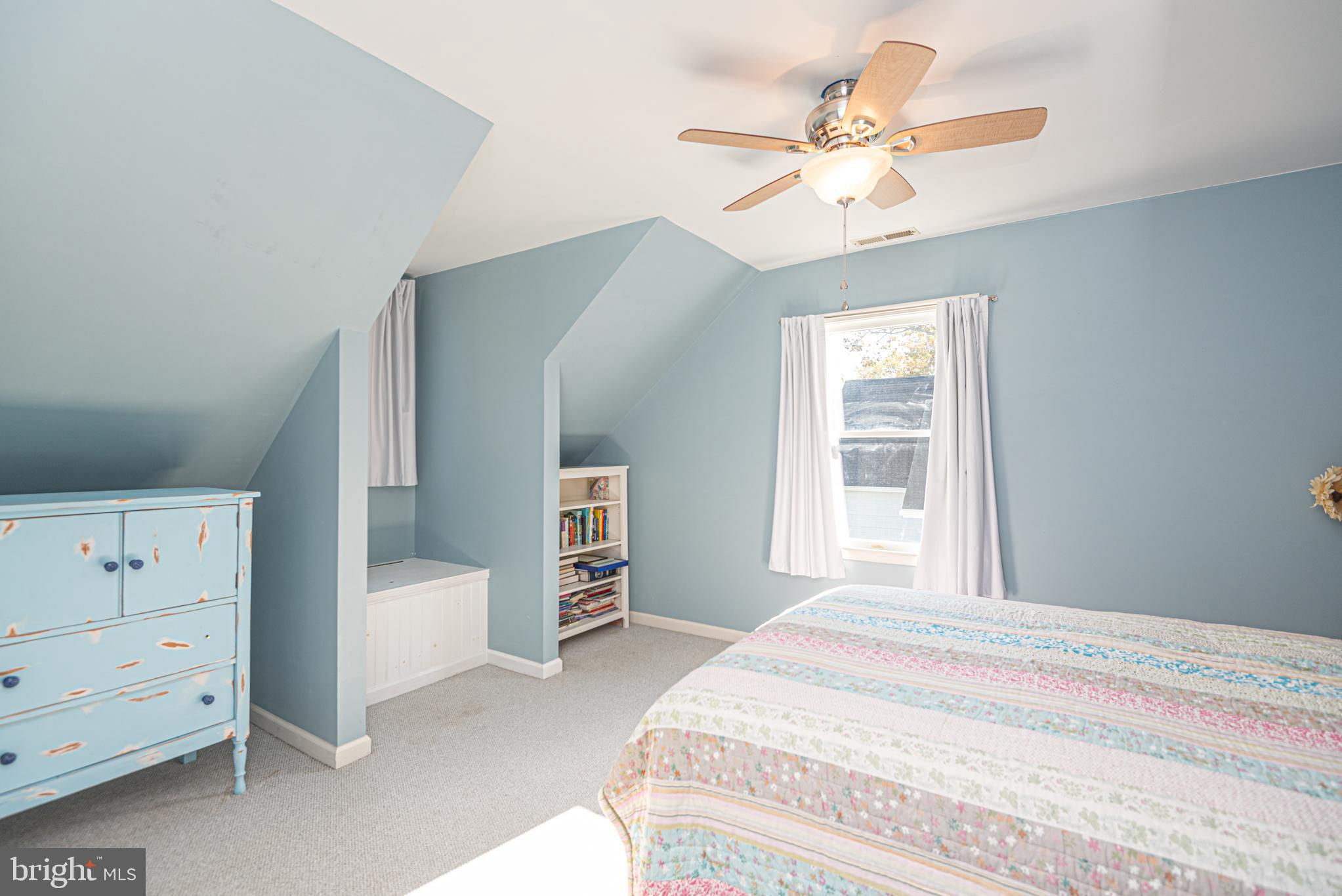 263 Oyster Shell Cove Bethany Beach, DE 19930 - Photo 22 of 50 a bedroom with a bed and a chandelier