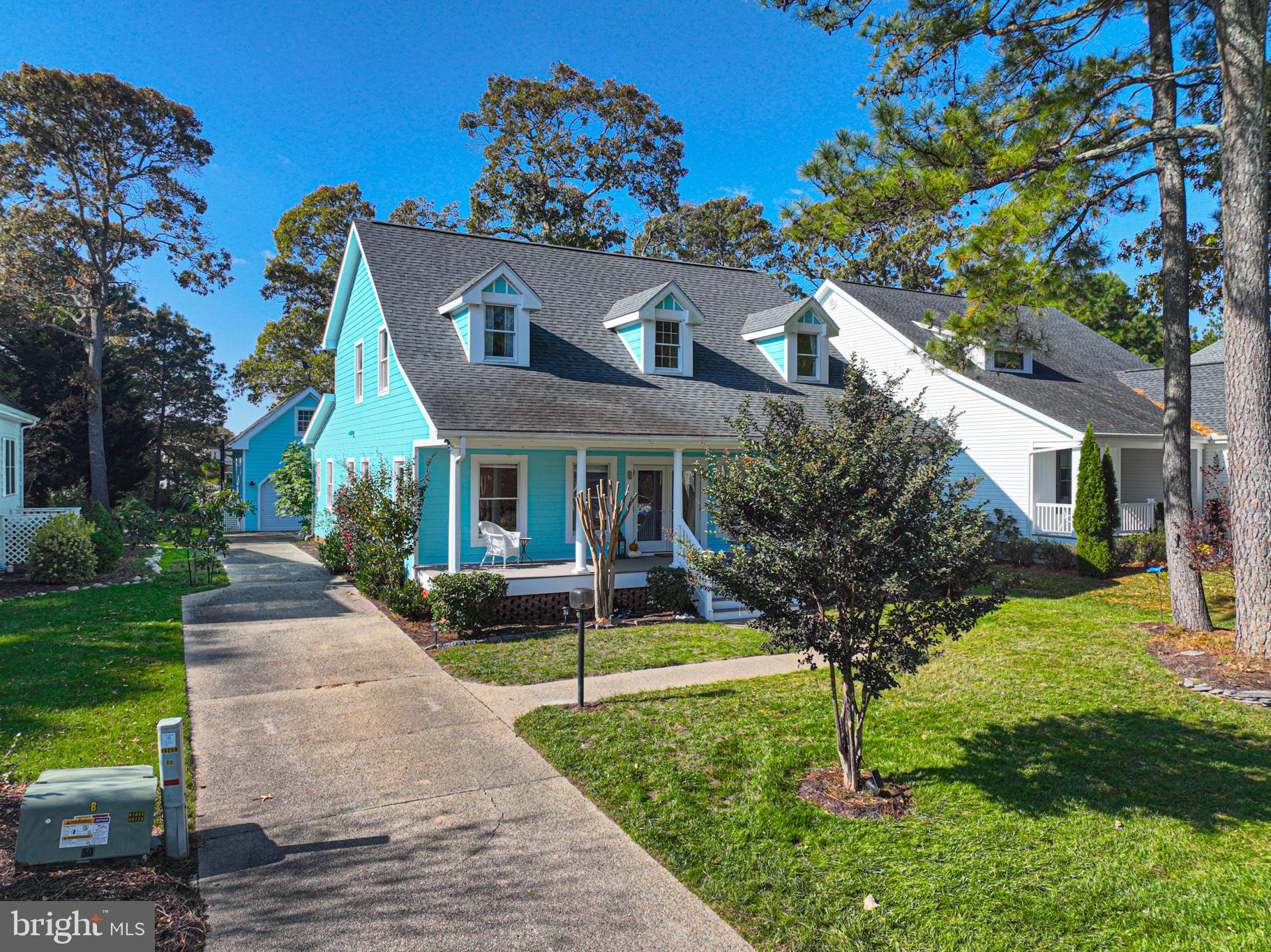 263 Oyster Shell Cove Bethany Beach, DE 19930 - Photo 3 of 50 a front view of house with yard and green space