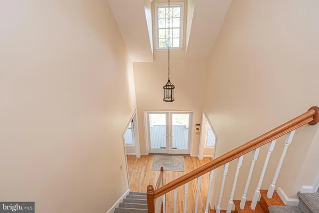 a view of an entryway with wooden floor