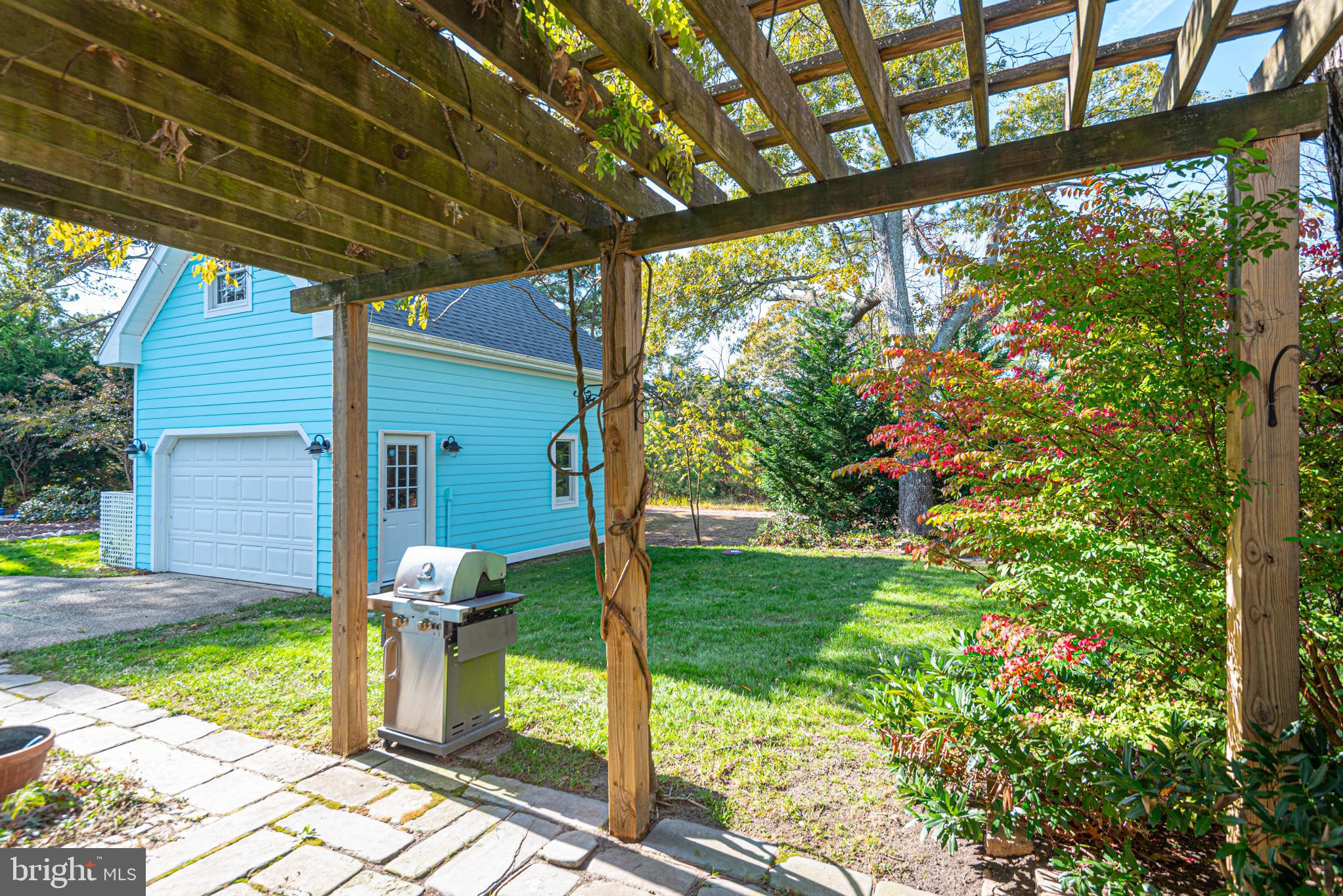 263 Oyster Shell Cove Bethany Beach, DE 19930 - Photo 36 of 50 a view of a porch with a yard