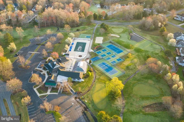 view of a swimming pool outdoor seating and yard