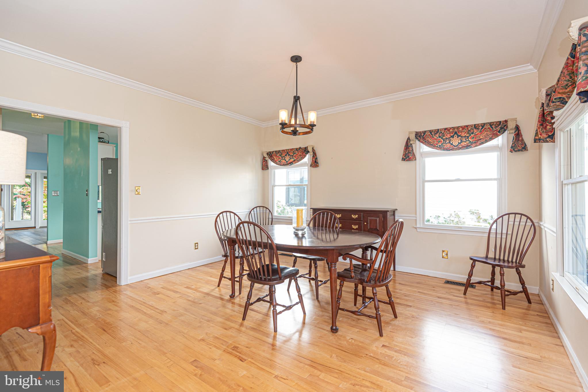 263 Oyster Shell Cove Bethany Beach, DE 19930 - Photo 10 of 50 a view of a dining room with furniture window and wooden floor