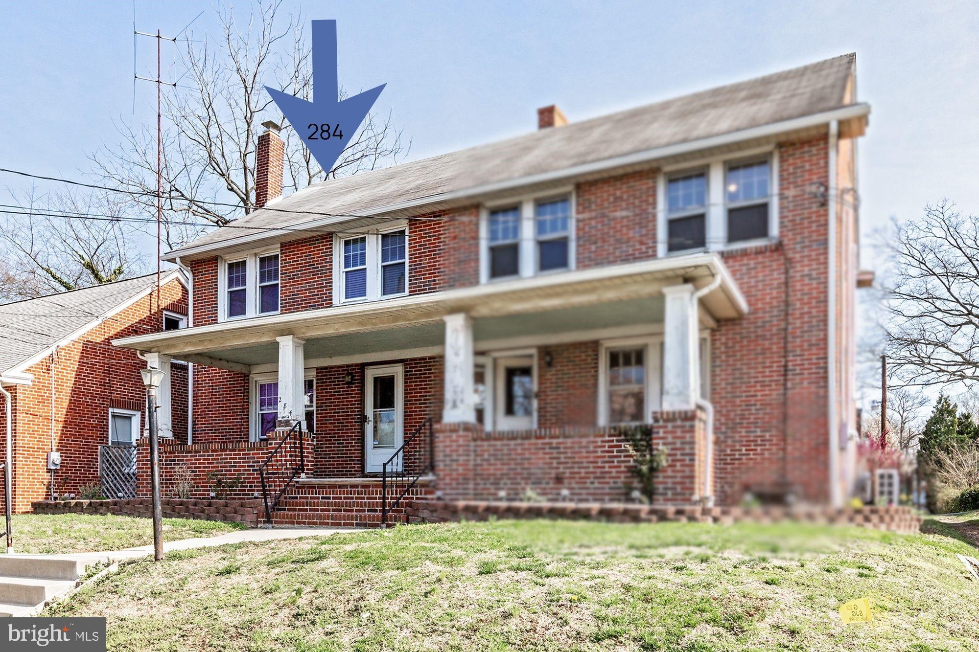 front view of a house with a yard