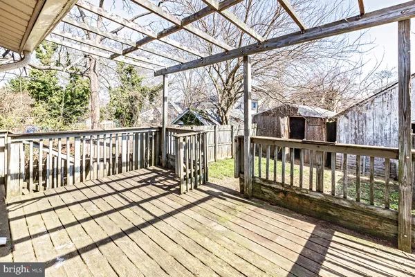 a view of a house with wooden fence