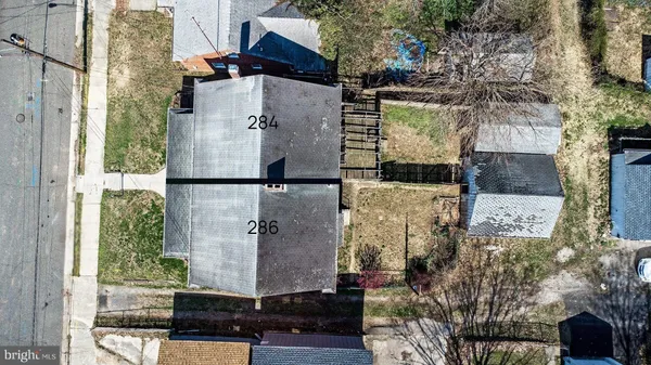 an aerial view of residential houses with outdoor space