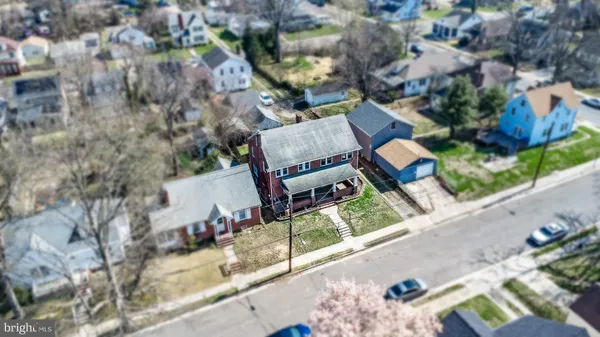 an aerial view of a house with outdoor space