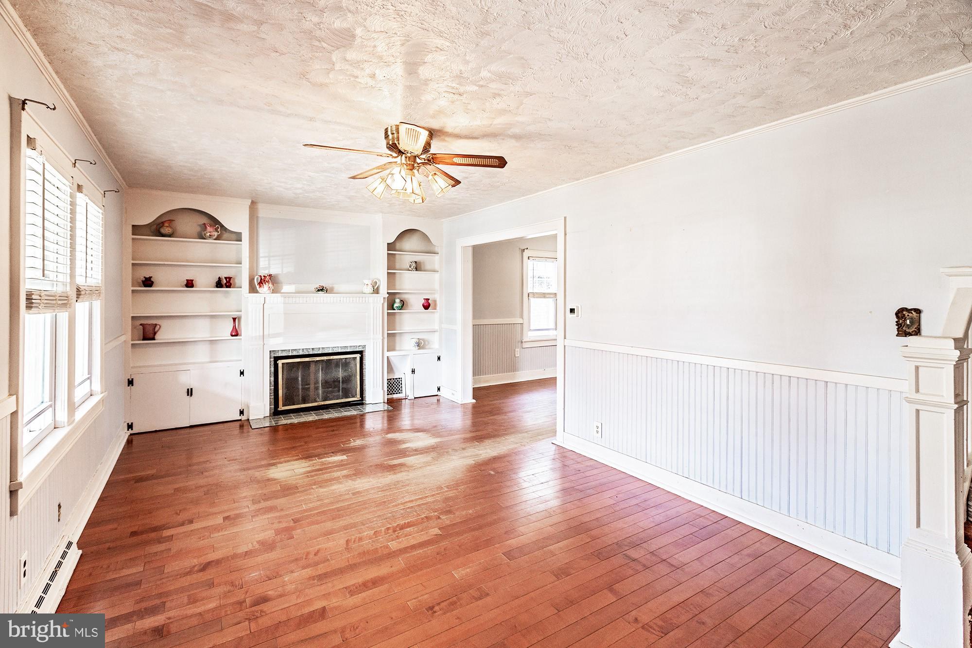 284 Morrison Avenue Salem, NJ 08079 - Photo 3 of 34 a view of a livingroom with wooden floor and a ceiling fan