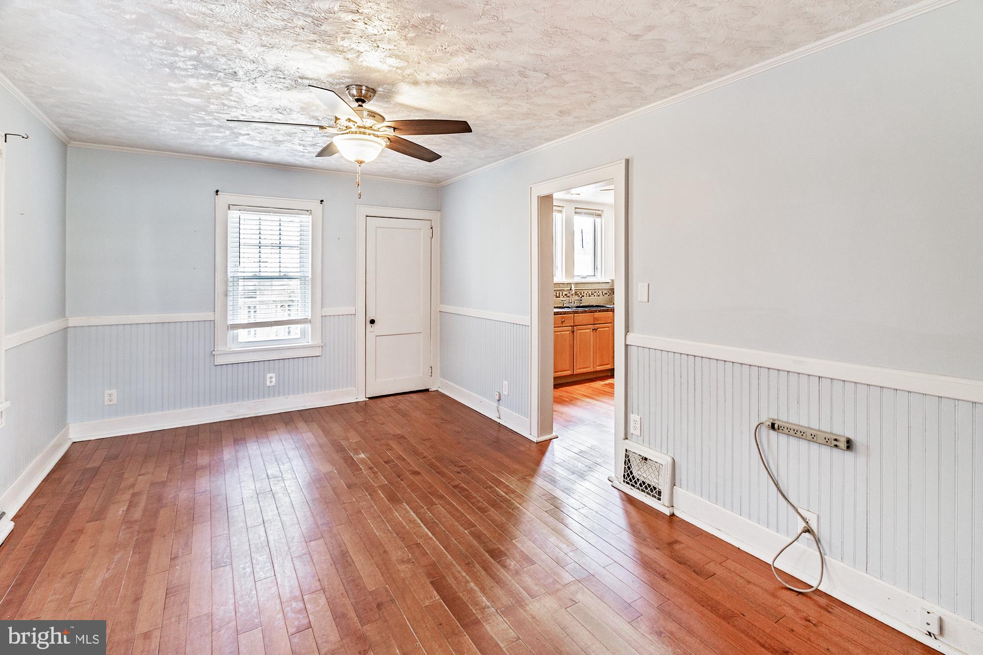 284 Morrison Avenue Salem, NJ 08079 - Photo 6 of 34 wooden floor in an empty room with a window