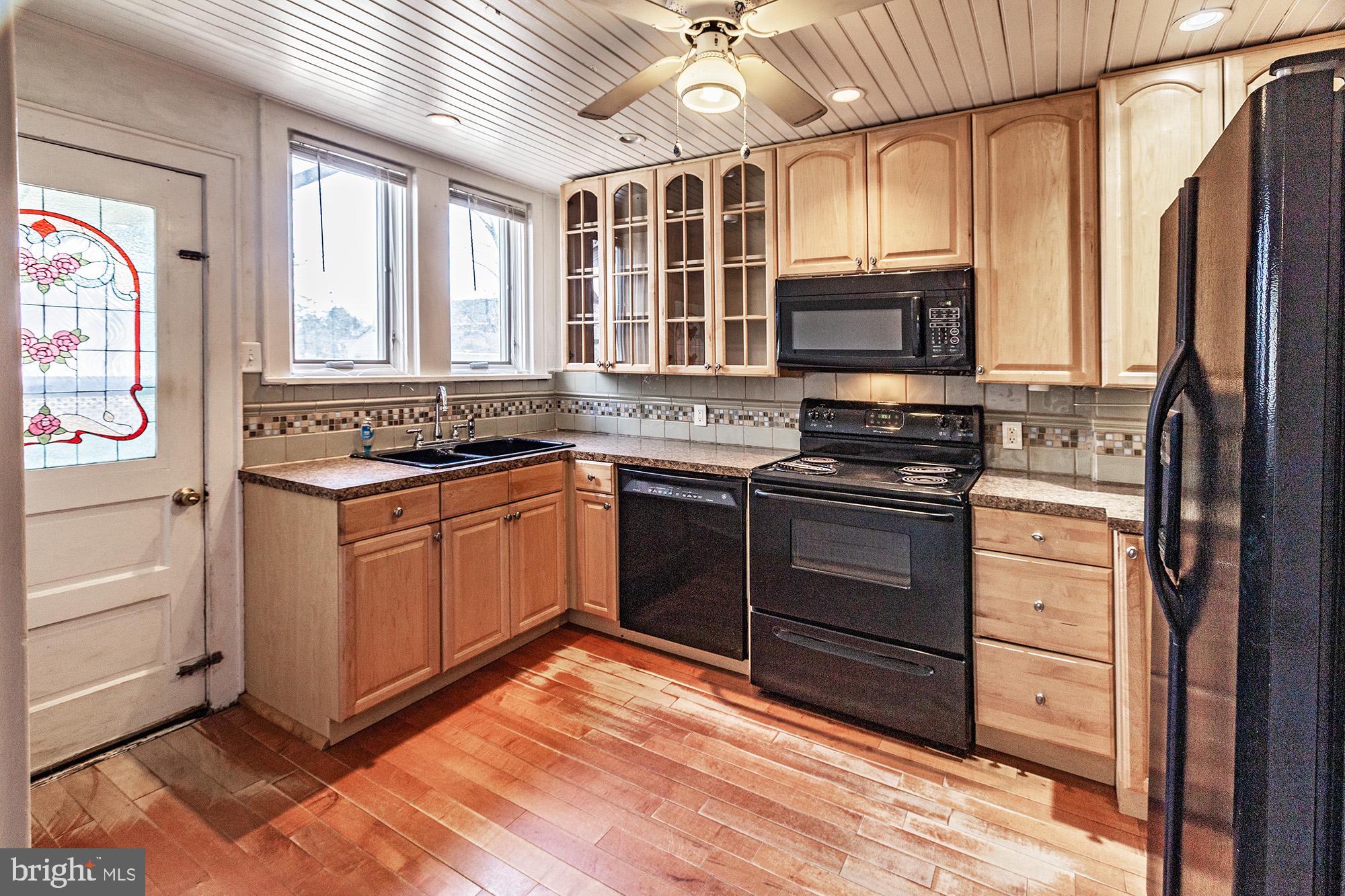 284 Morrison Avenue Salem, NJ 08079 - Photo 8 of 34 a kitchen with stainless steel appliances granite countertop a stove a sink and a refrigerator