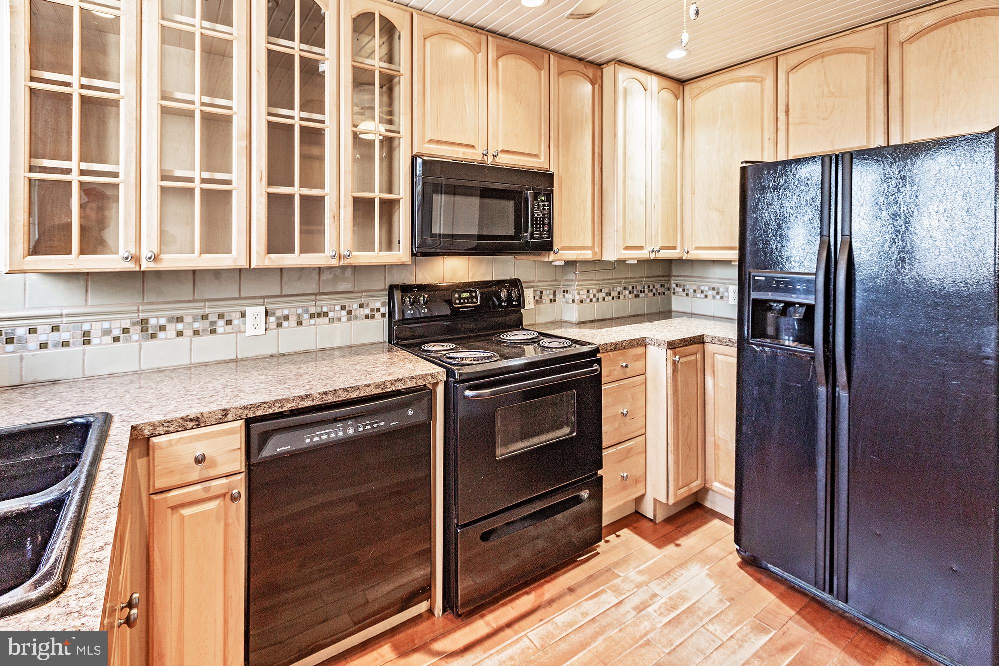 284 Morrison Avenue Salem, NJ 08079 - Photo 9 of 34 a kitchen with stainless steel appliances granite countertop a stove and a refrigerator