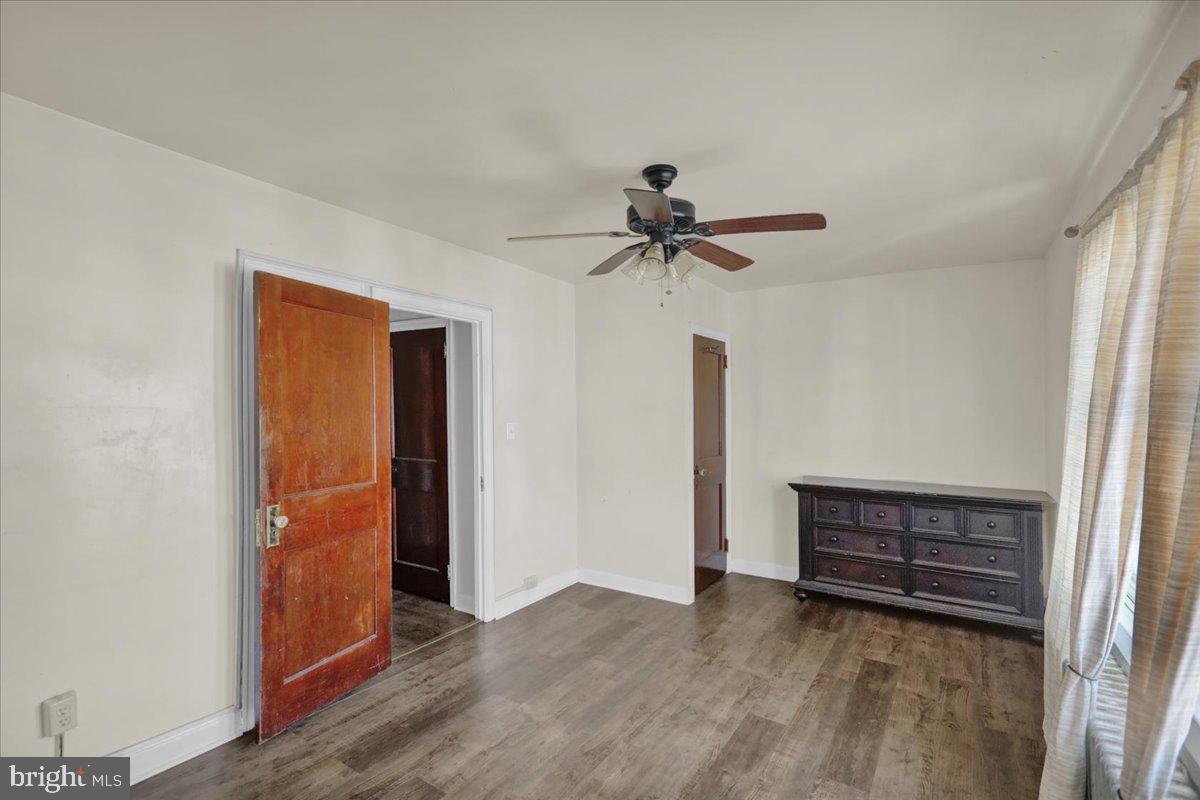 224 Hanley Place Reading, PA 19611 - Photo 15 of 19 a view of room with hardwood floor and a ceiling fan