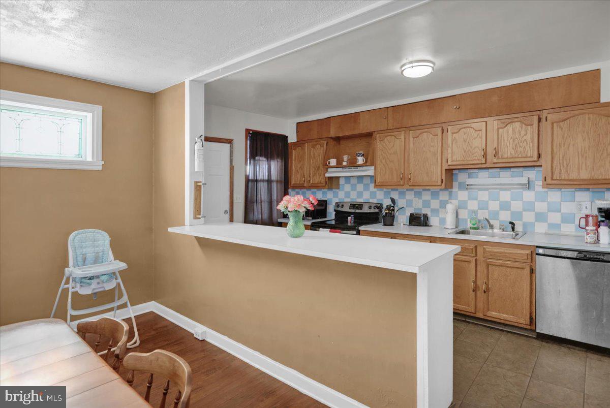 224 Hanley Place Reading, PA 19611 - Photo 9 of 19 a kitchen with a sink cabinets and window