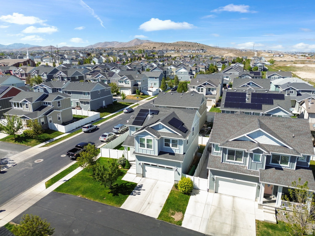 5155 East Rio Grande Way Eagle Mountain, UT 84005 - Photo 34 of 40 Aerial perspective of suburban area with a mountainous background