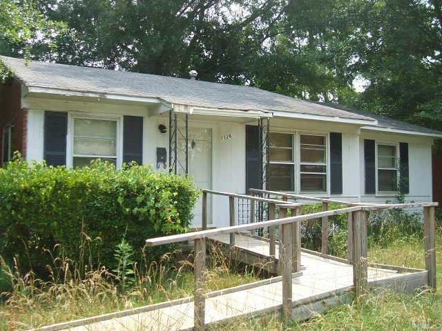 1126 Brighton Road Raleigh, NC 27610 - Photo 1 of 1 a view of a house with a window and a tree