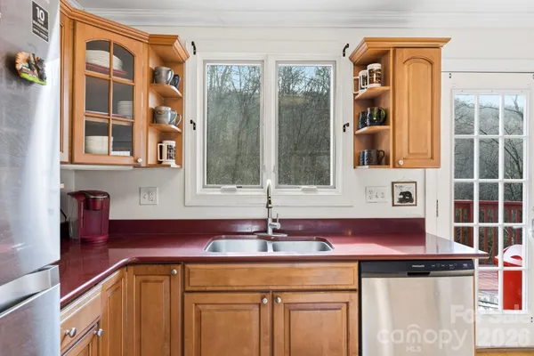 a kitchen with a sink and a window