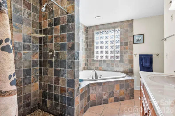 a bathroom with a bathtub and a sink