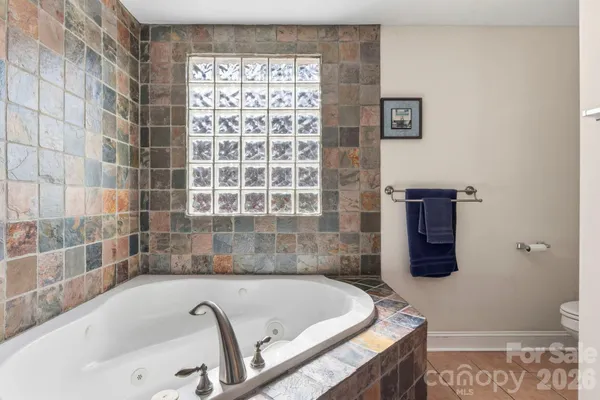 a bath tub sitting next to a window