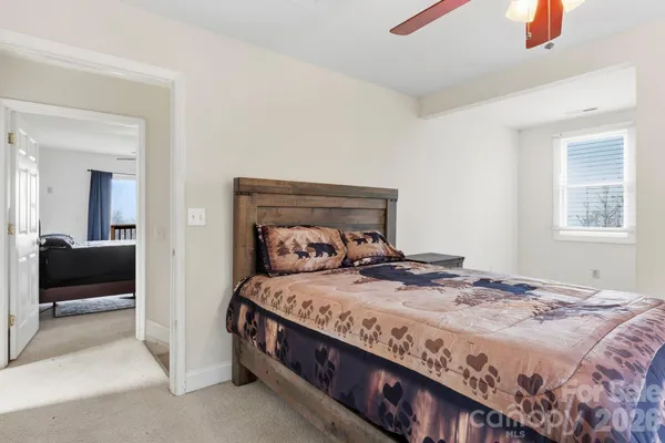 a bedroom with a bed and a view of bedroom