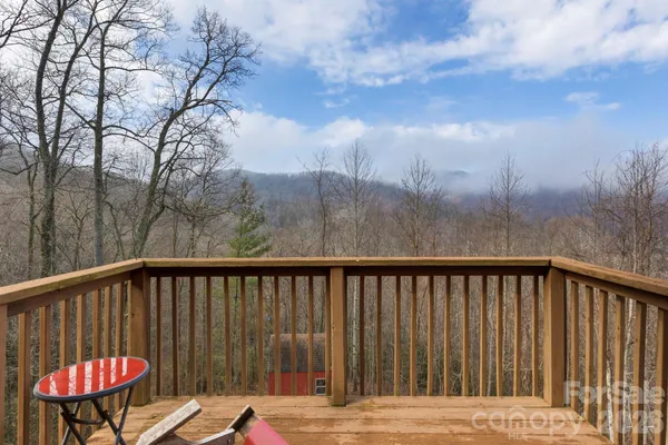 a balcony with wooden floor