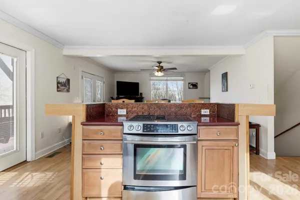 a kitchen with a stove and cabinets