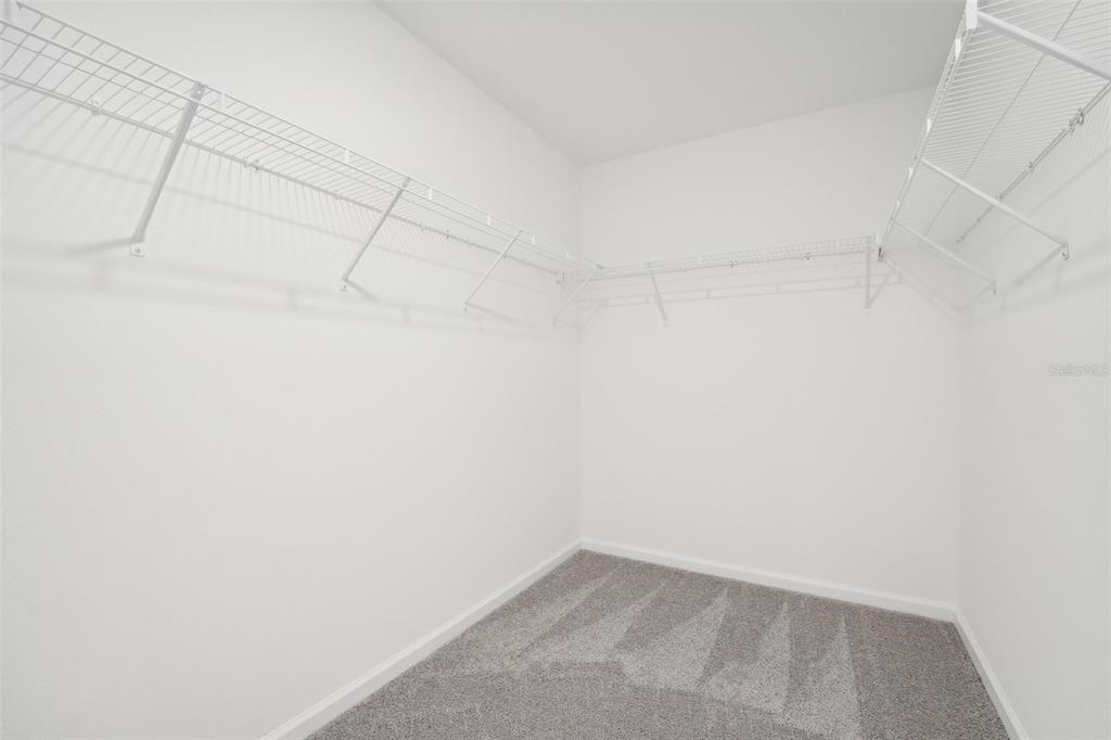 14907 Lucca Way Dade City, FL 33523 - Photo 16 of 46 a view of a room with racks on the wall