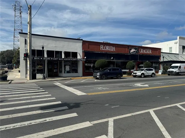 a living room with furniture a book shelf and a book shelf