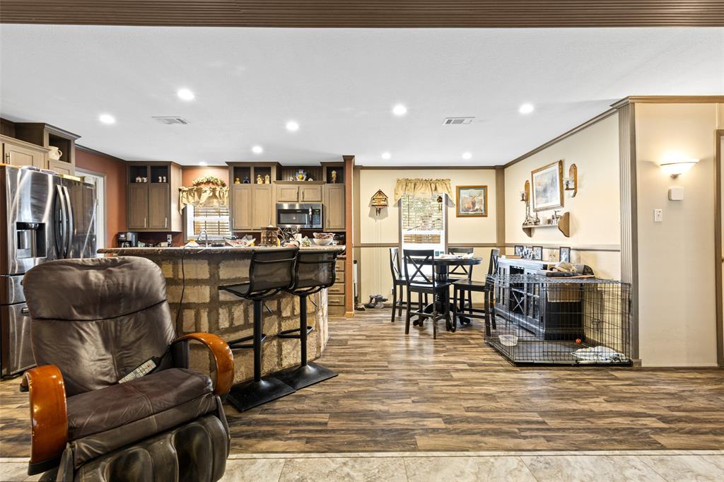 454 Geronimo Quitman, TX 75783 - Photo 11 of 37 a living room filled with furniture and a dining table