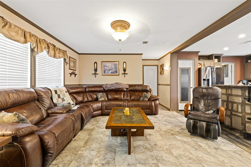 454 Geronimo Quitman, TX 75783 - Photo 16 of 37 a living room with furniture and a flat screen tv