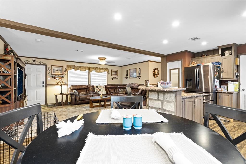 454 Geronimo Quitman, TX 75783 - Photo 20 of 37 a living room with lots of furniture and kitchen view