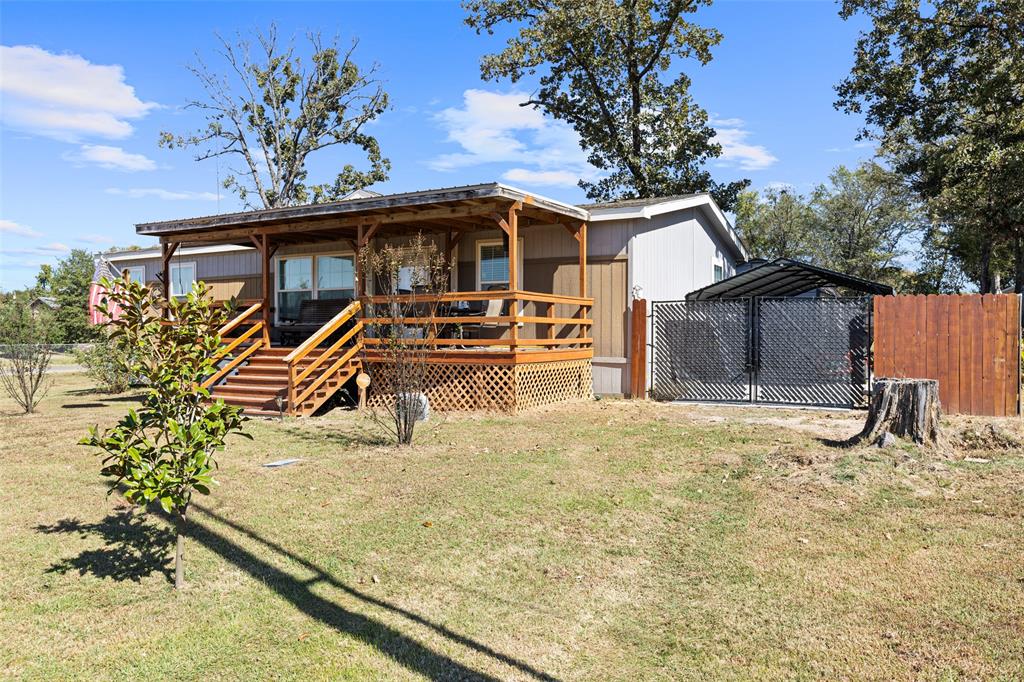 454 Geronimo Quitman, TX 75783 - Photo 31 of 37 a view of a house with backyard porch and sitting area
