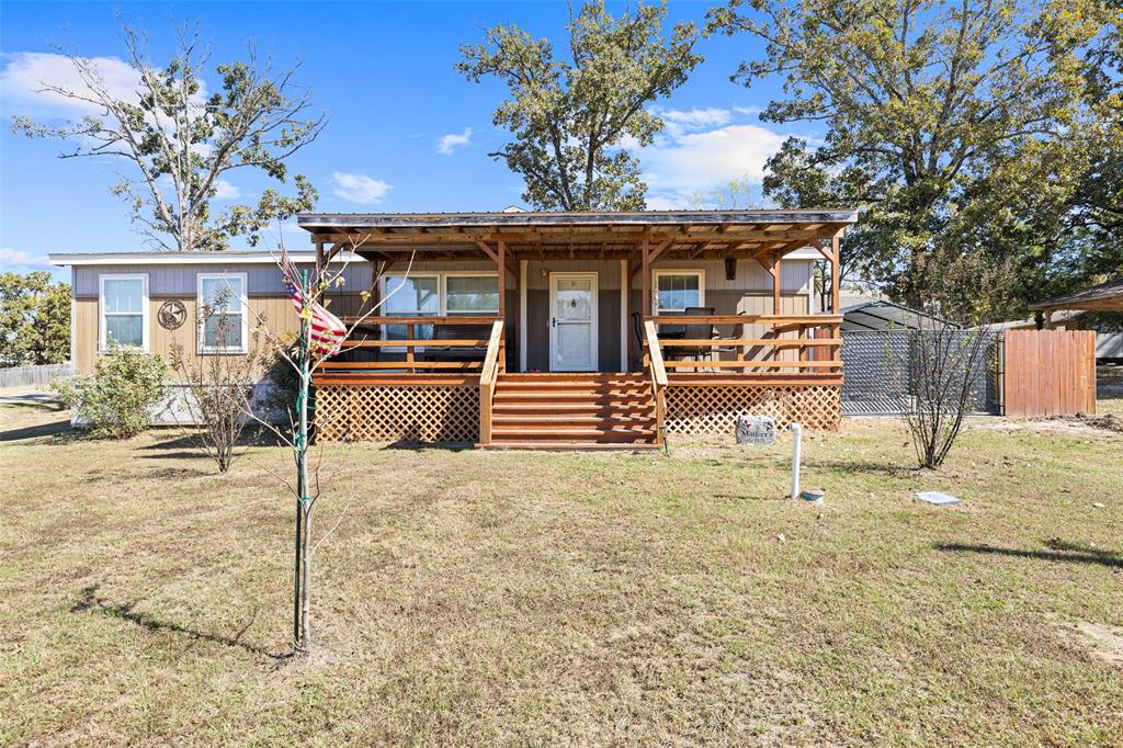 454 Geronimo Quitman, TX 75783 - Photo 9 of 37 a front view of a house with a yard