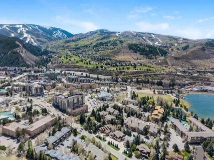 a kitchen with stainless steel appliances granite countertop a sink refrigerator and cabinets