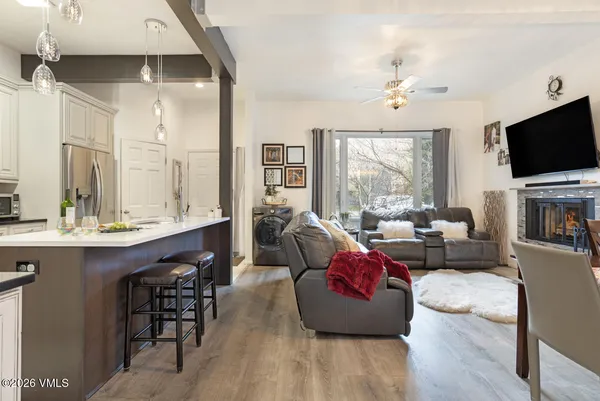 a living room with furniture and a large window