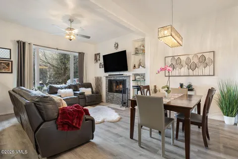 a kitchen with stainless steel appliances granite countertop a stove top oven a sink and dishwasher
