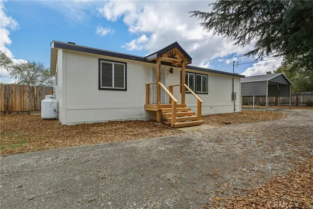 a house with trees in the background