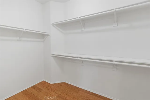 a view of a patio with a table and chairs and potted plants