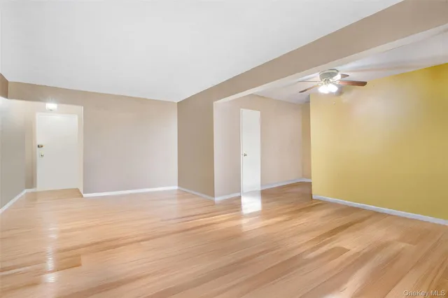 a view of an empty room with glass door