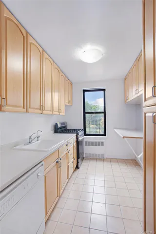 a large white kitchen with a sink