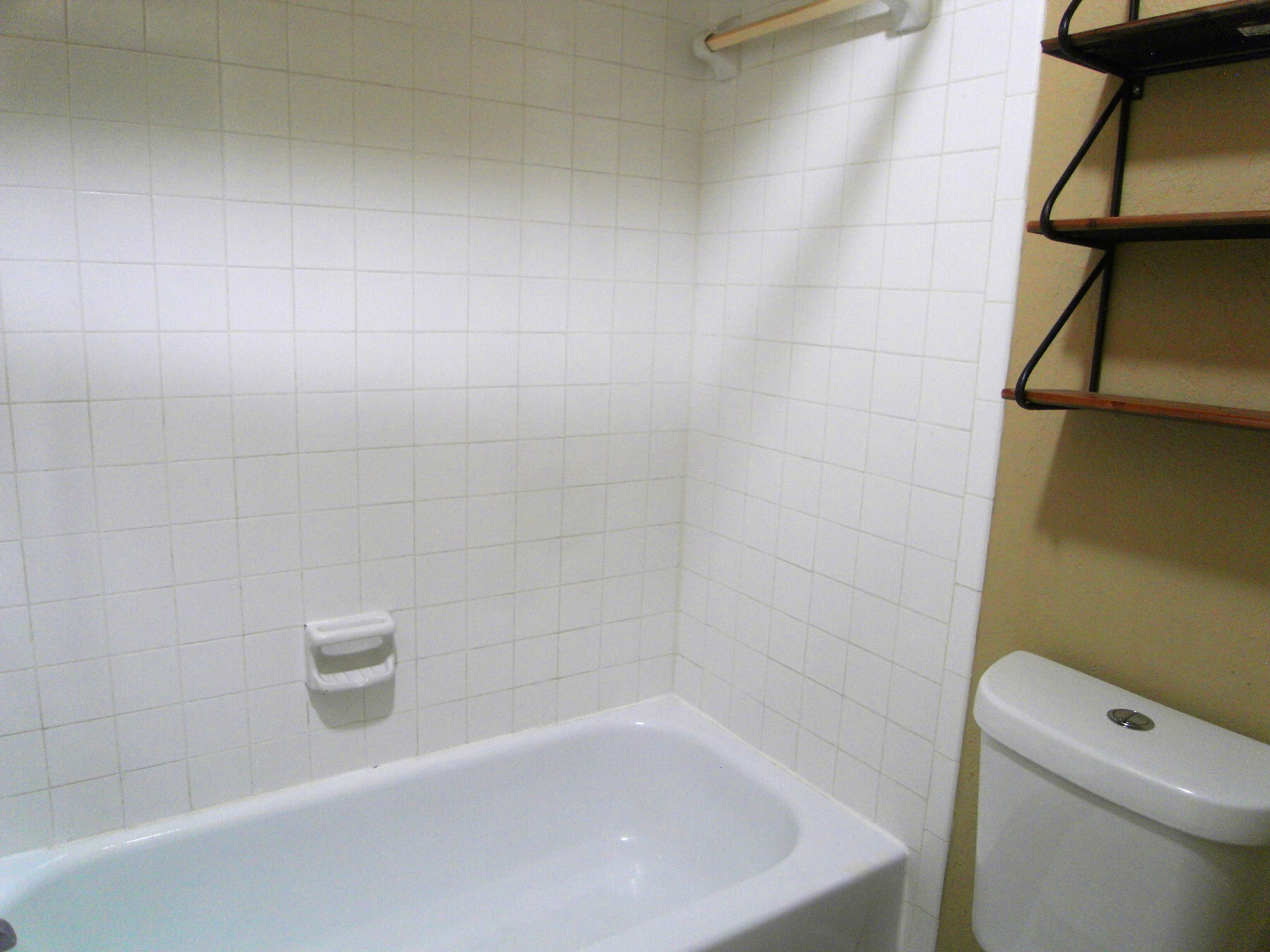 14911 Wunderlich Drive, Unit 1108 Houston, TX 77069 - Photo 18 of 26 a bath tub sitting next to a white toilet and a sink