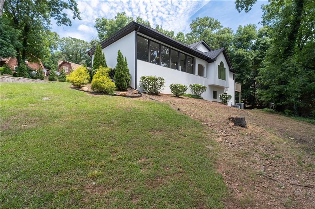 4610 West Morton Road Alpharetta, GA 30022 - Photo 4 of 53 a front view of a house with a yard