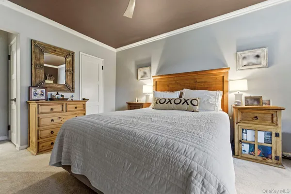 a bedroom with a bed and dresser