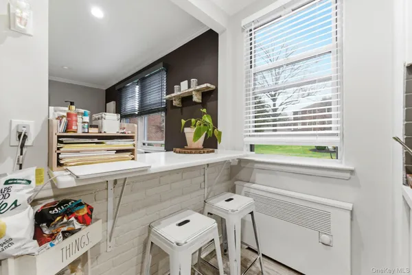 a kitchen with a sink cabinets and window