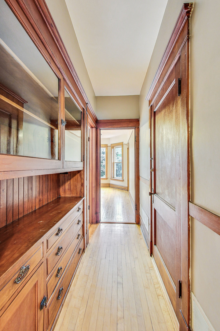 1312 West Nelson Street, Unit 3 Chicago, IL 60657 - Photo 14 of 15 a view of hallway with wooden floor