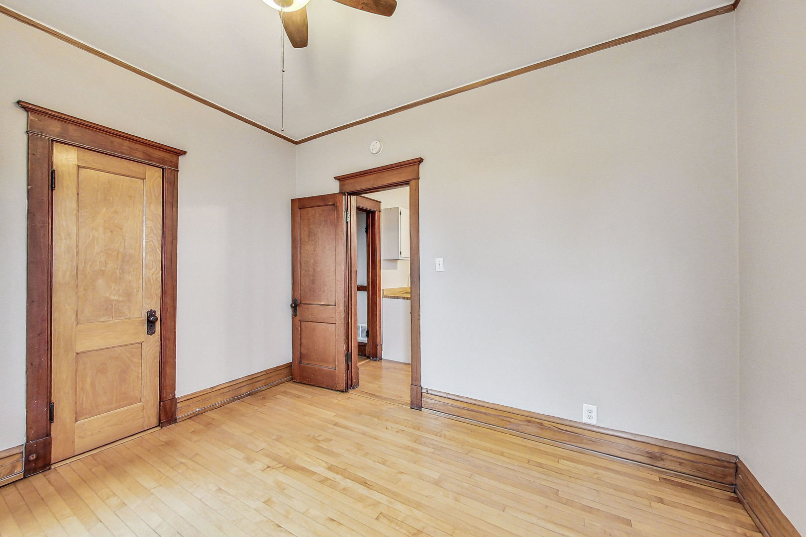 1312 West Nelson Street, Unit 3 Chicago, IL 60657 - Photo 9 of 15 a view of an empty room with a chandelier fan