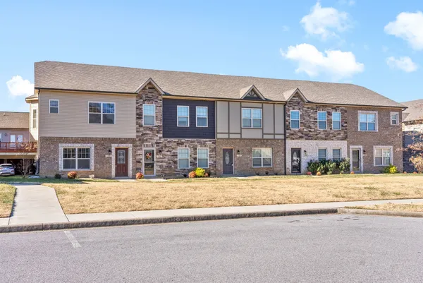 a front view of residential houses with street