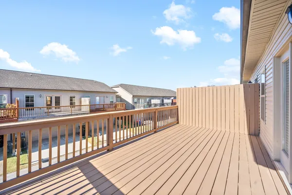 a view of balcony with wooden floor