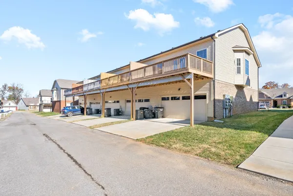 a front view of a building with a yard