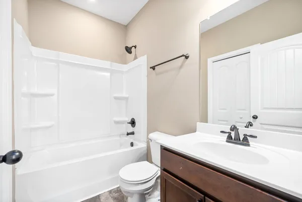 a bathroom with a sink a toilet and a bathtub