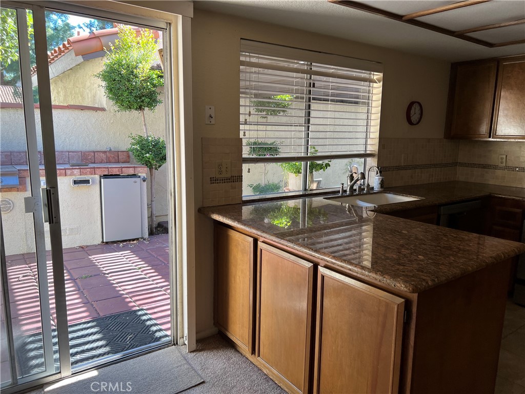 525 San Marcos Road San Dimas, CA 91773 - Photo 5 of 22 a kitchen view with a sink and refrigerator