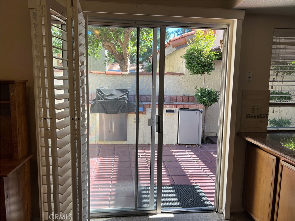525 San Marcos Road San Dimas, CA 91773 - Photo 6 of 22 a view of a hallway with wooden floor and a dining room